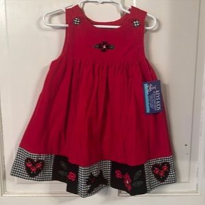 Cute red corduroy girls jumper w black white checked bottoms trim
